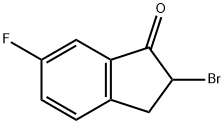 2-BROMO-2,3-DIHYDRO-6-FLUORO-1H-INDEN-1-ONE 化学構造式