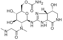 [3aS,(-)]-2-[[4-O-アミノカルボニル-2-[メチル[(メチルアミノ)アセチル]アミノ]-2-デオキシ-β-D-グロピラノシル]アミノ]-1,3aβ,5,6,7,7aα-ヘキサヒドロ-7β-ヒドロキシ-4H-イミダゾ[4,5-c]ピリジン-4-オン 化学構造式