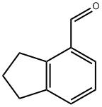 2,3-ジヒドロ-1H-インデン-4-カルブアルデヒド 化学構造式